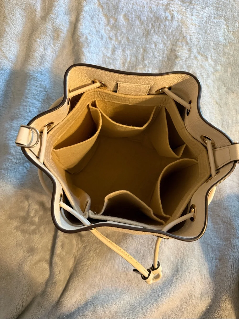 kate spade Cream Pebble Leather Drawstring Bucket Bag with Striped Strap